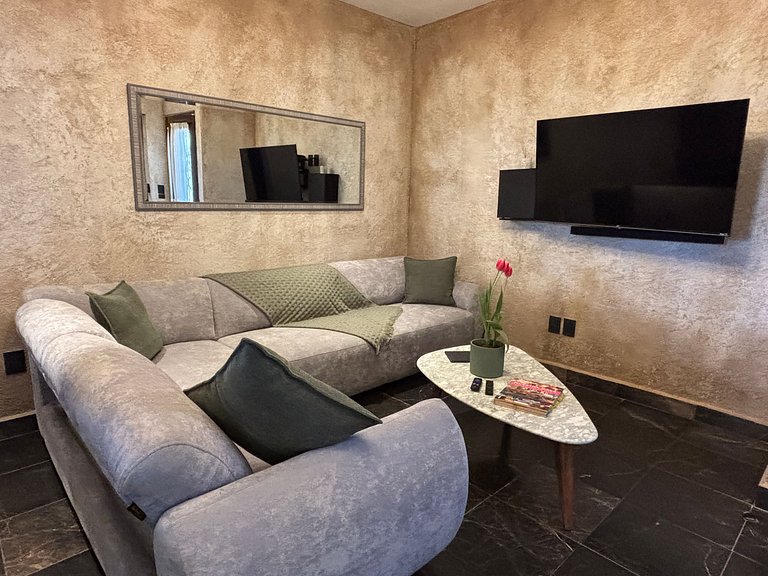 Departamento Zeus: Estilo y Confort en Val’Quirico